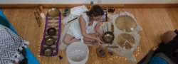 Woman using sound meditation equipment